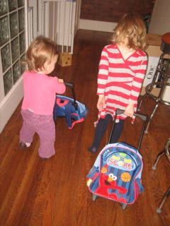 girls-playing-with-elmo-suitcases.jpg